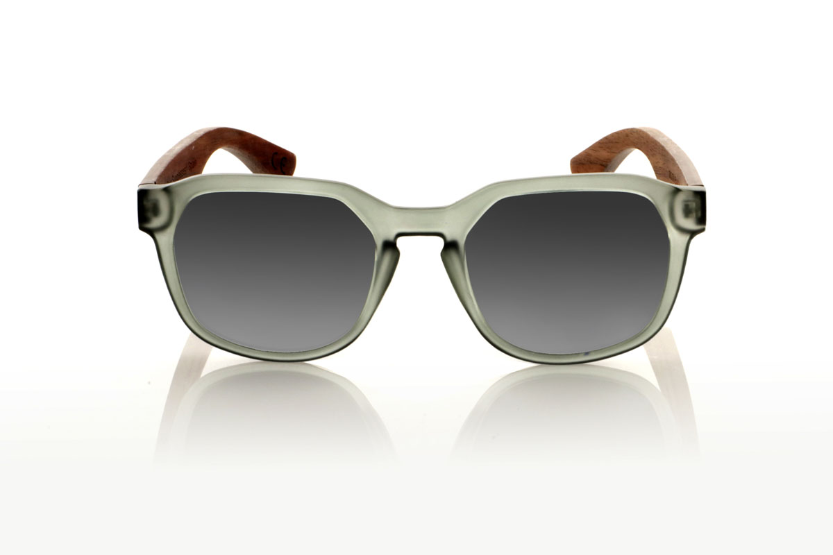 Wood eyewear of Walnut MOON BLACK. The MOON BLACK are your new favorite sunglasses, with a hexagonal PC frame in matte transparent gray and walnut wood temples. Perfect for those looking for a special touch in their daily life, these glasses mix design and nature in a unique way. Comfortable to wear and great for seeing everything in a new light, they adapt to any look and occasion. Moon black are the ideal complement for any face. Try them and feel how they complement your style. Front measurement: 148x50mm. Caliber: 53 for Wholesale & Retail | Root Sunglasses® 